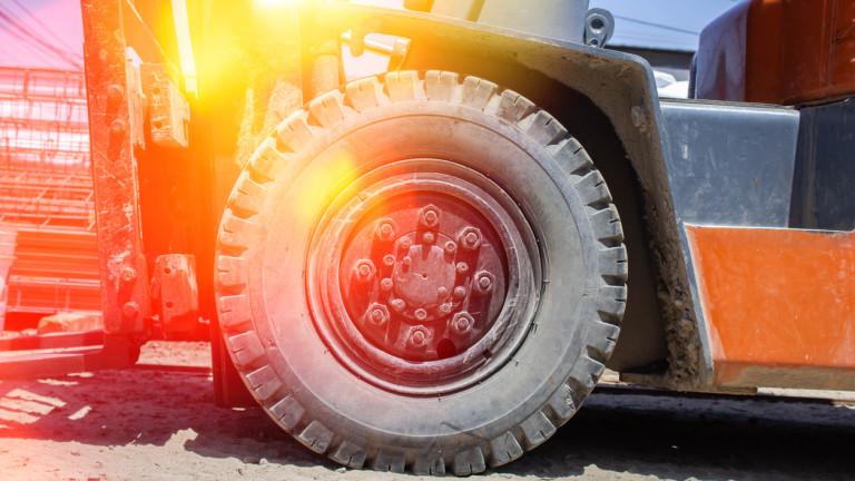 closeup to forklift tire in construction concept