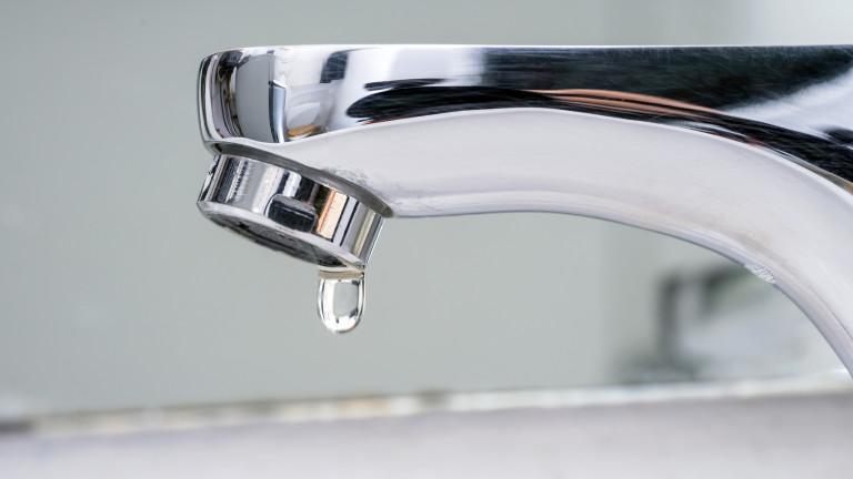 Drop of water falling from faucet.